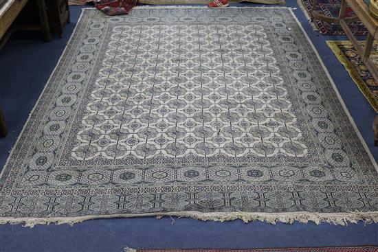 A Bokhara style cream ground carpet, 11ft 6in. x 8ft 5in.